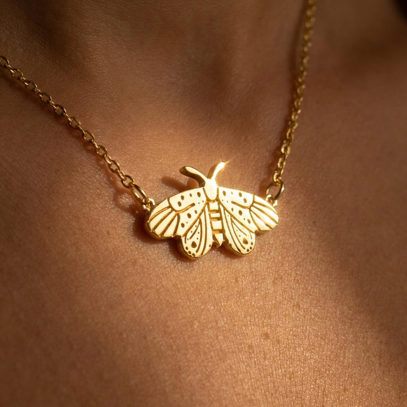Fine gold chain necklace with a small moth pendant with open wings and antennae (2 of 10)
