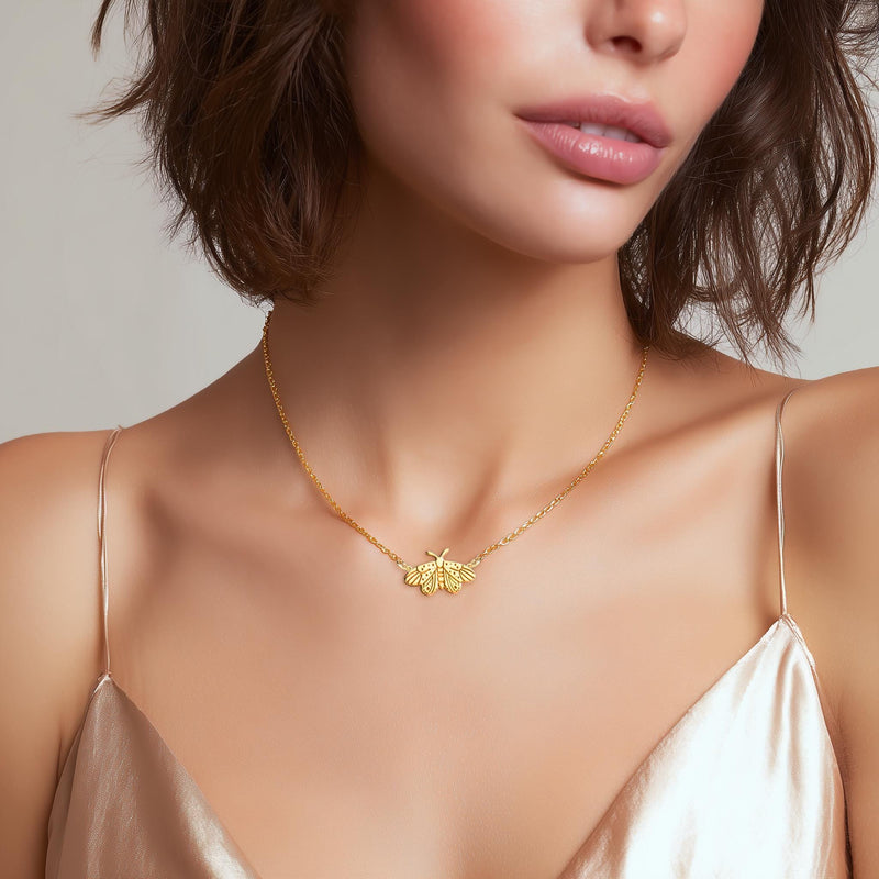Fine gold chain necklace with a small moth pendant with open wings and antennae (6 of 10)