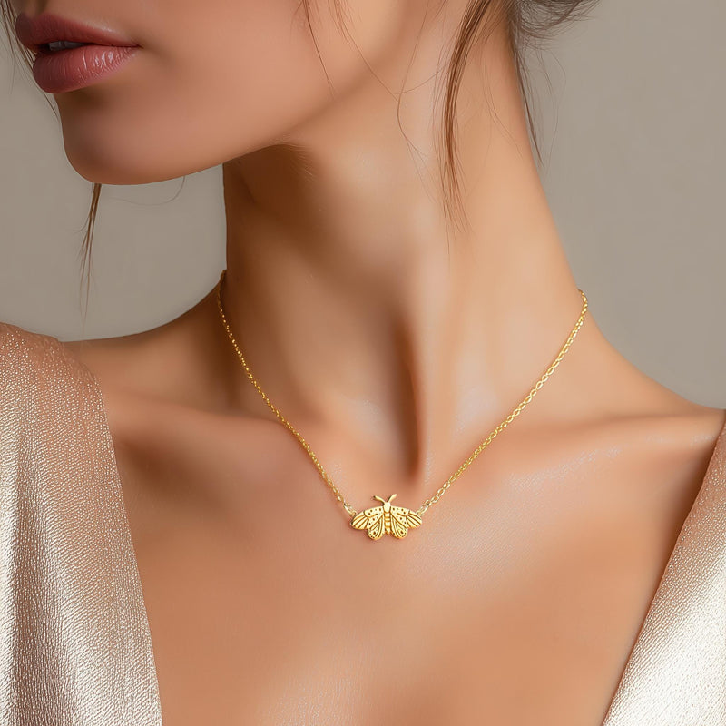 Fine gold chain necklace with a small moth pendant with open wings and antennae (7 of 10)
