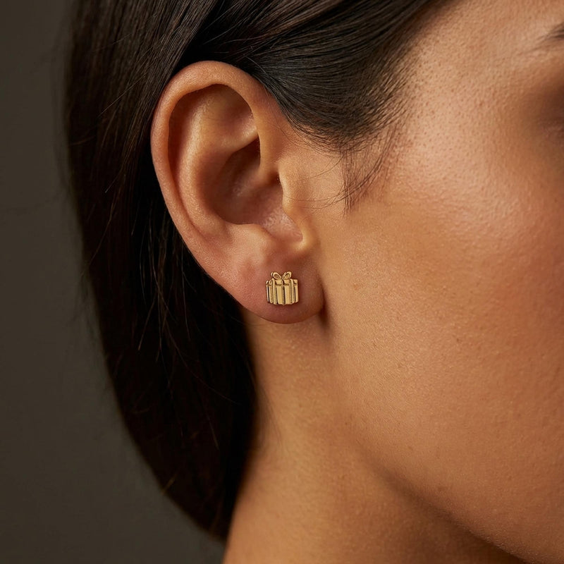 Pair of tiny gold present stud earrings with a ribbon across the front and a bow on top (7 of 11)