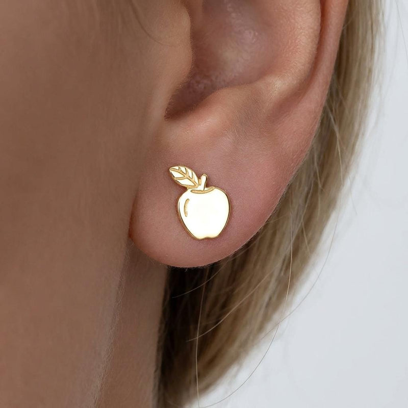 Pair of tiny gold apple stud earrings with stem and leaf, shown on white (2 of 10)