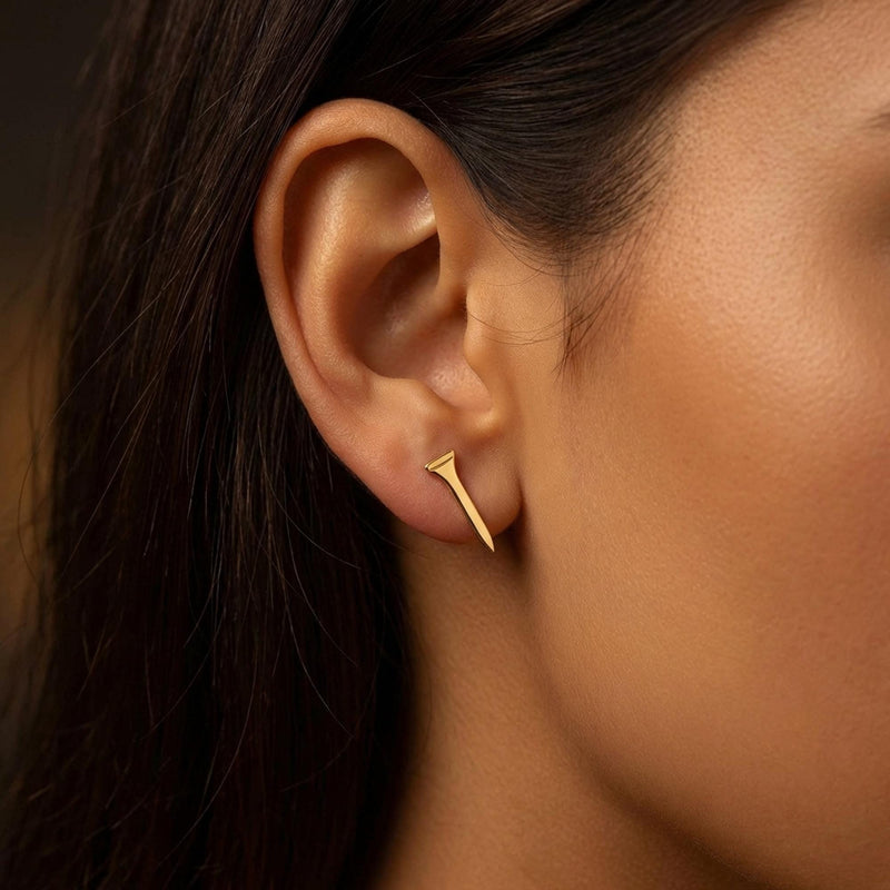 Pair of narrow gold golf tee stud earrings standing upright, front view. (2 of 10)