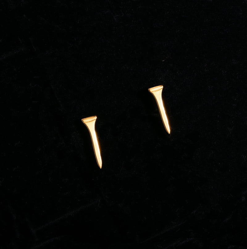 Pair of narrow gold golf tee stud earrings standing upright, front view. (7 of 10)