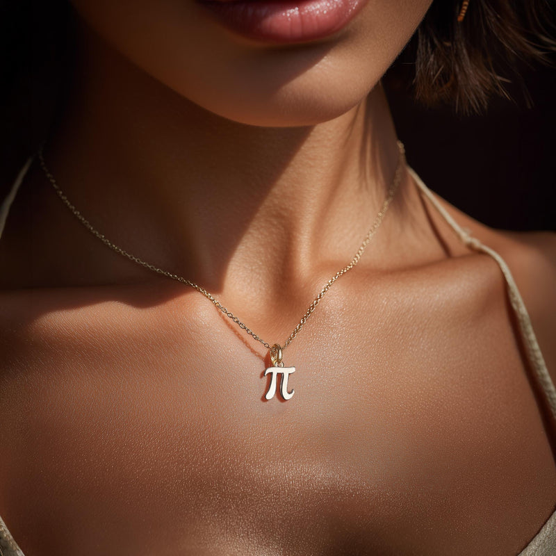 Small gold pi symbol pendant hanging from a fine cable chain (4 of 10)