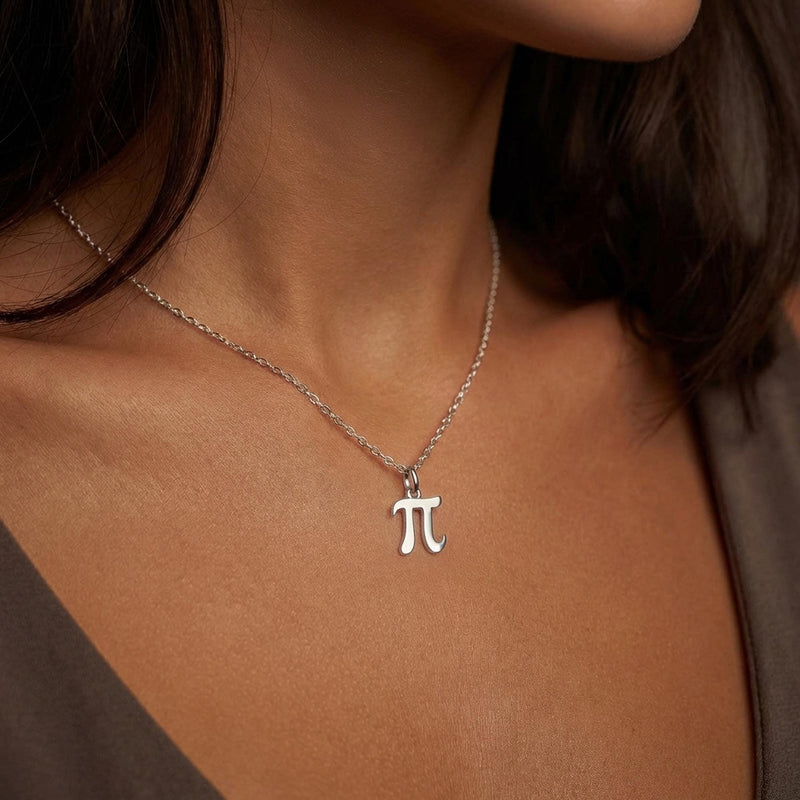 Small gold pi symbol pendant hanging from a fine cable chain (5 of 10)