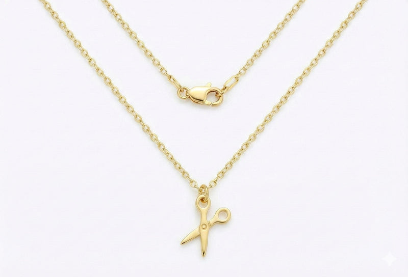 Fine gold necklace with a flat open scissors pendant