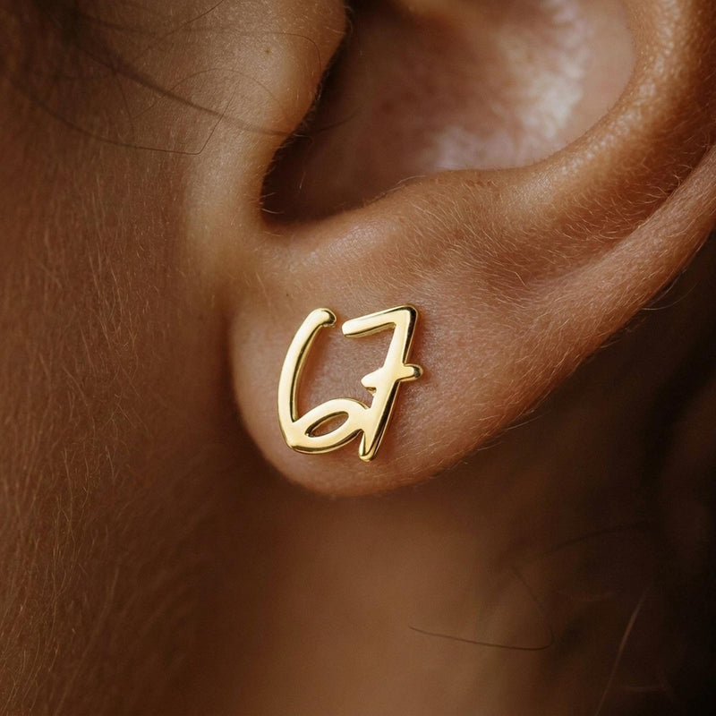 Pair of gold number stud earrings, one reading six and one reading seven (10 of 11)