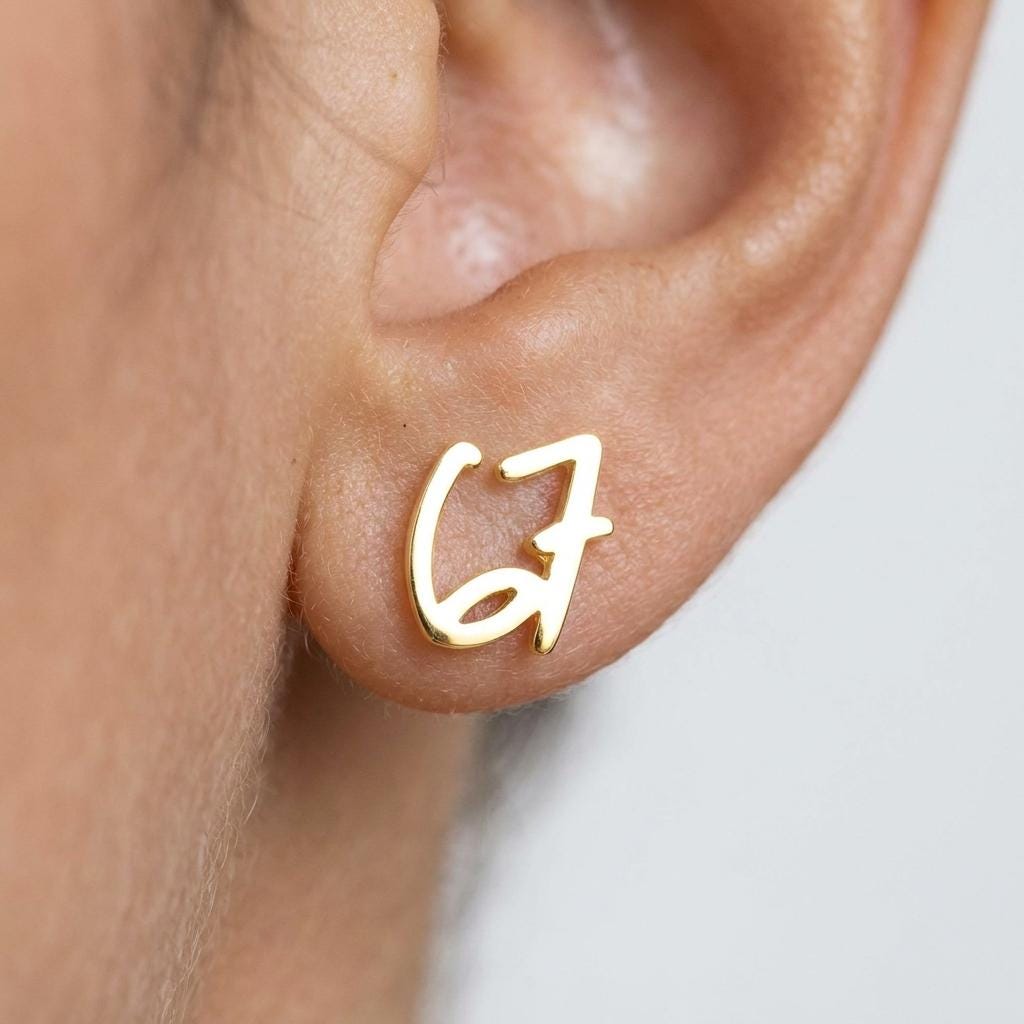 Pair of gold number stud earrings, one reading six and one reading seven (2 of 11)