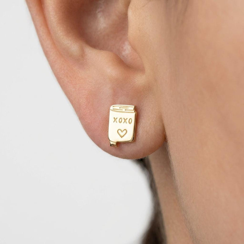 Pair of small gold XOXO letter stud earrings in a handwritten style (2 of 7)