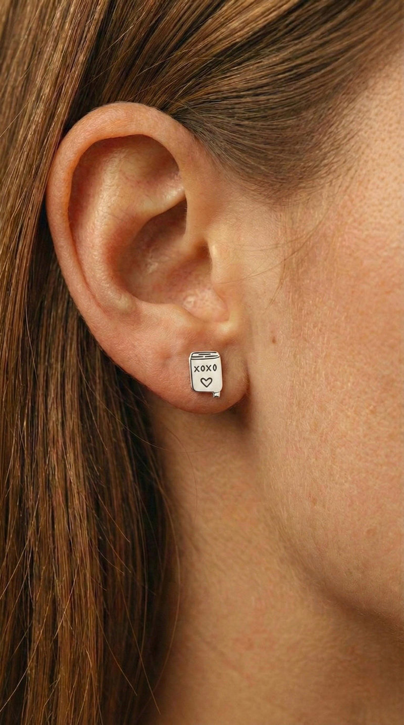 Pair of small gold XOXO letter stud earrings in a handwritten style (3 of 7)