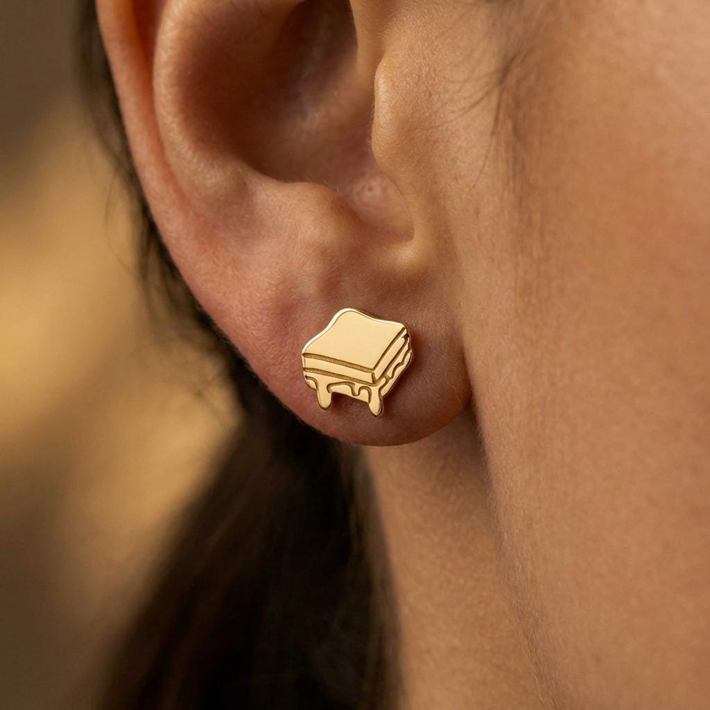 Small gold grilled cheese stud earrings with a cheese drip
