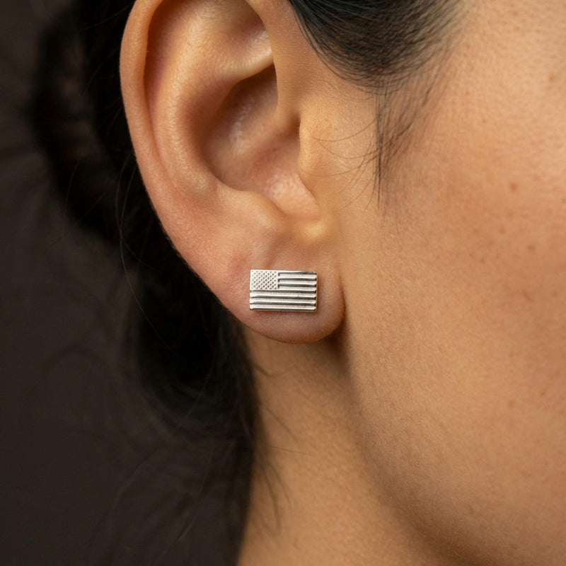 Pair of tiny gold American flag stud earrings with stars and stripes, on white (10 of 10)