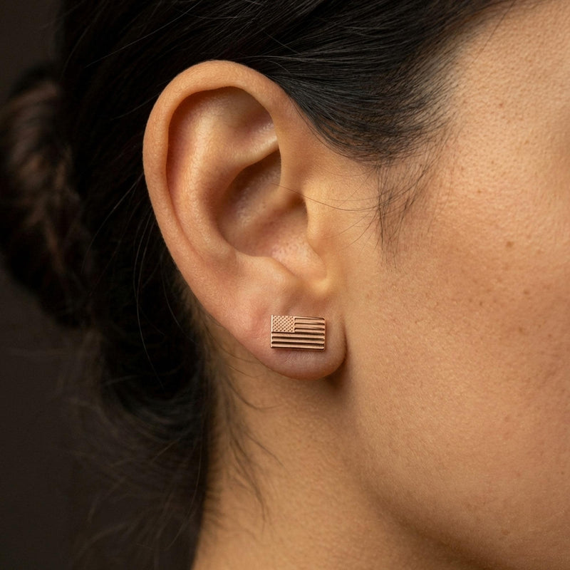 Pair of tiny gold American flag stud earrings with stars and stripes, on white (9 of 10)