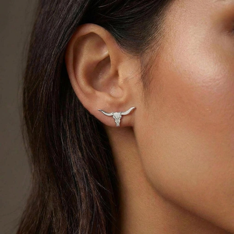 Pair of gold longhorn steer skull stud earrings with wide sweeping horns (4 of 10)