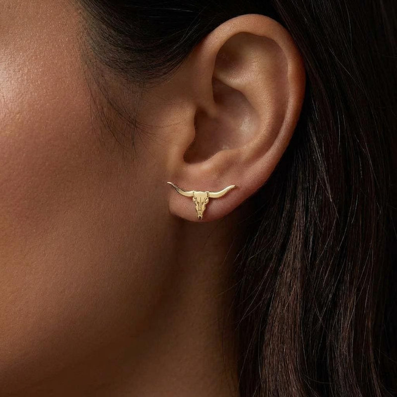 Pair of gold longhorn steer skull stud earrings with wide sweeping horns (5 of 10)