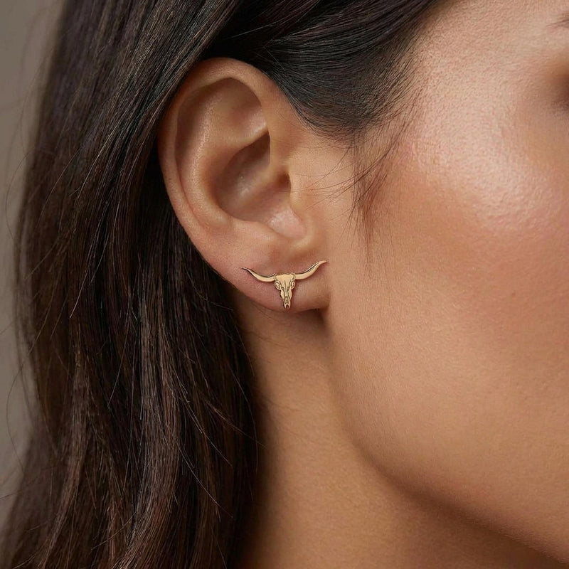 Pair of gold longhorn steer skull stud earrings with wide sweeping horns (6 of 10)
