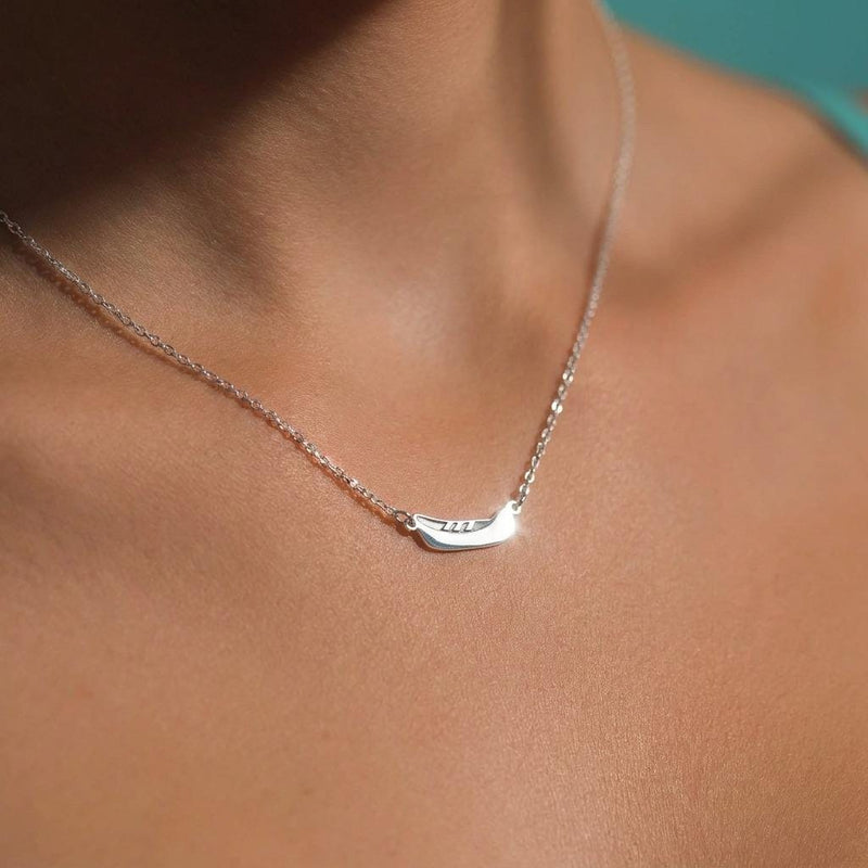 Dainty gold canoe pendant on a fine chain, shown from the side (6 of 12)