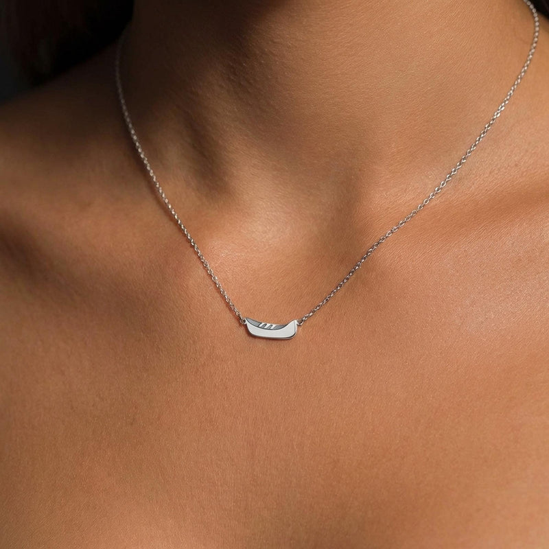 Dainty gold canoe pendant on a fine chain, shown from the side (7 of 12)