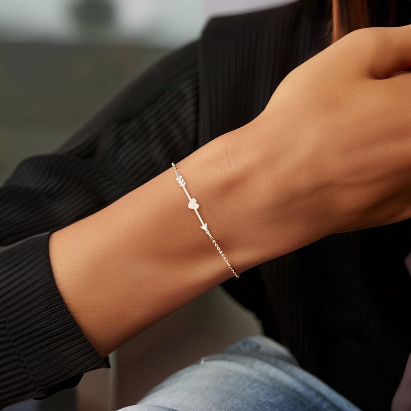 Fine gold chain bracelet with a flat heart and arrow charm (11 of 14)