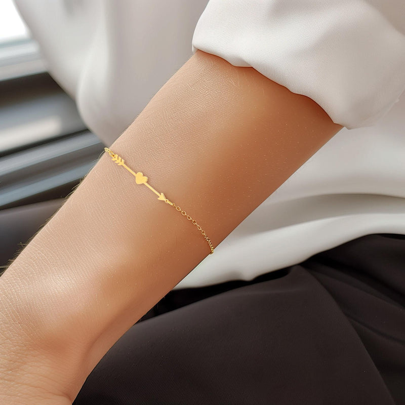 Fine gold chain bracelet with a flat heart and arrow charm (14 of 14)