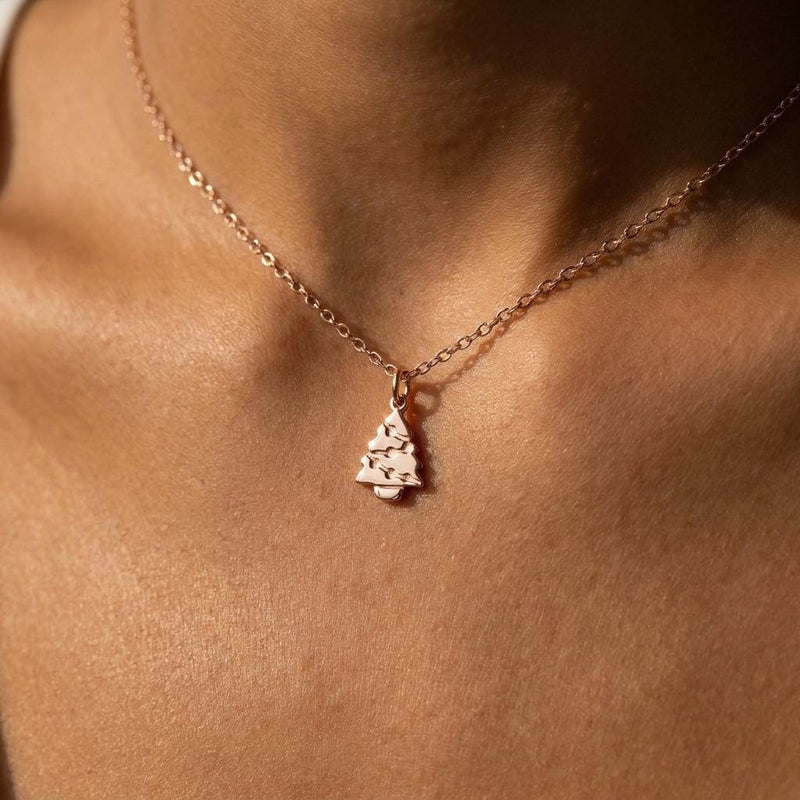 Fine gold chain necklace with a small tiered Christmas tree pendant (3 of 11)