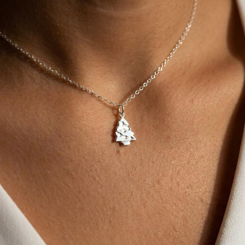 Fine gold chain necklace with a small tiered Christmas tree pendant (4 of 11)