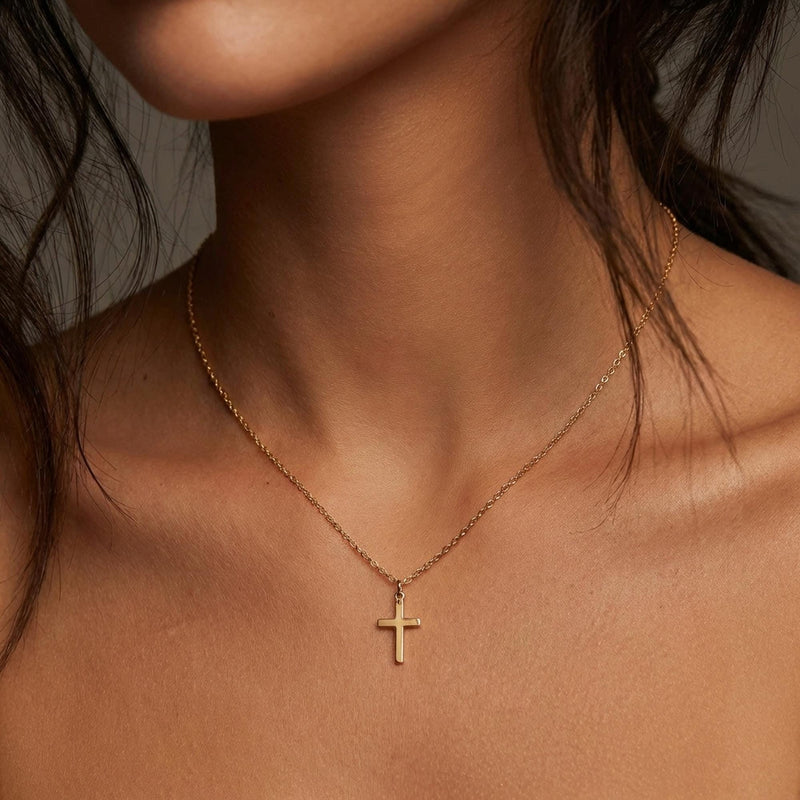 Fine gold chain necklace with a small plain cross pendant (16 of 16)