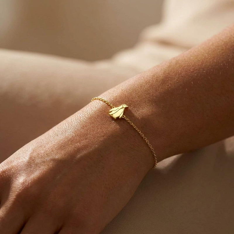 Fine gold chain bracelet with a tiny upright penguin charm (4 of 8)