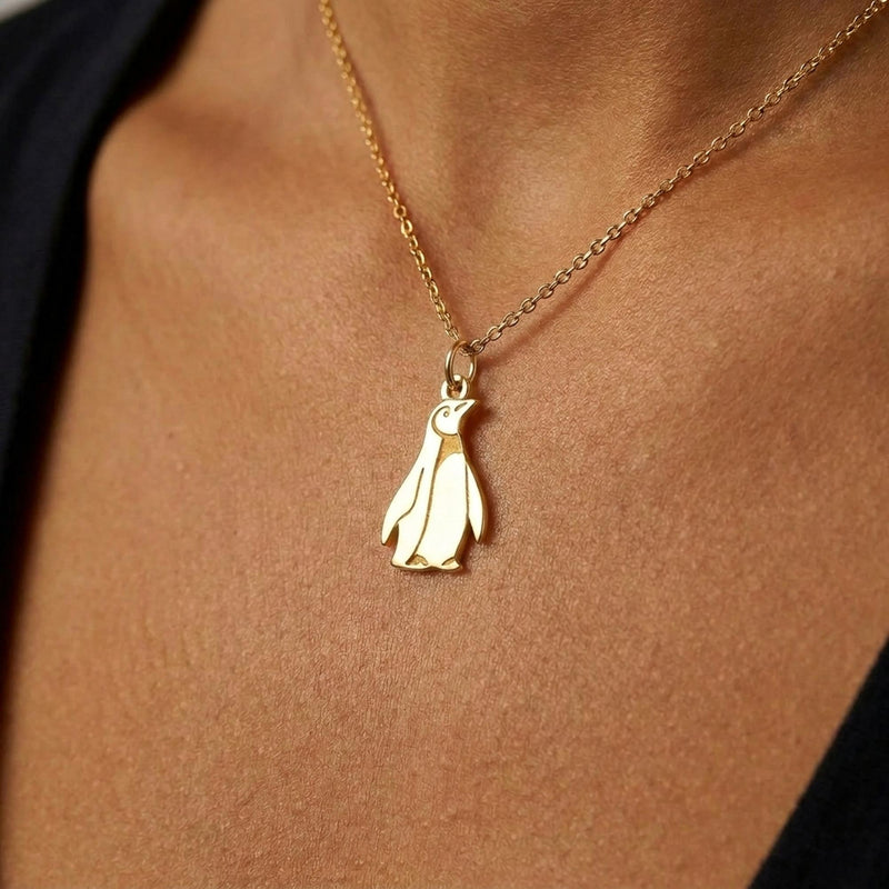 Tiny gold penguin pendant standing upright on a fine cable chain (2 of 5)