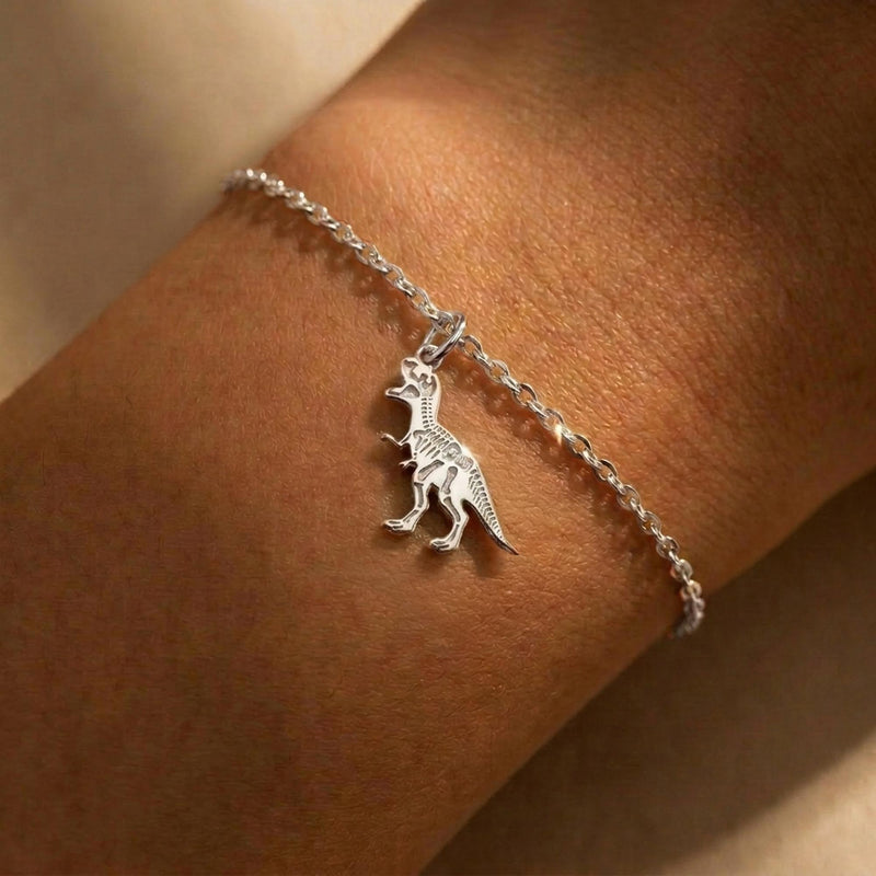 Fine gold chain bracelet with a small T-Rex skull fossil charm (4 of 8)