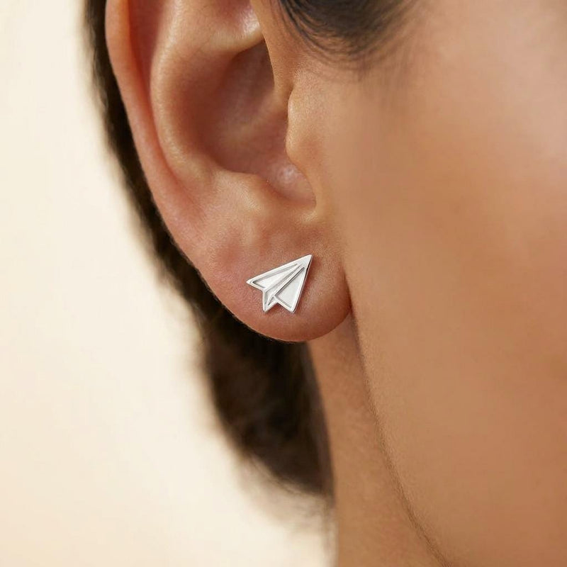 Tiny gold paper airplane stud earrings with cut fold lines, shown as a pair (4 of 7)