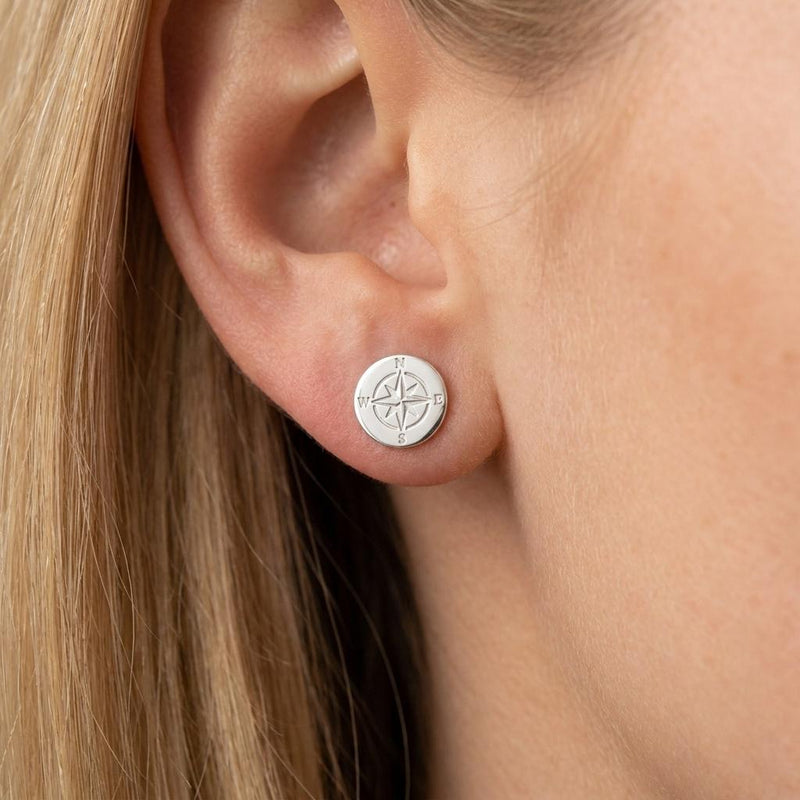 Pair of very small gold compass rose stud earrings with four points. (2 of 9)