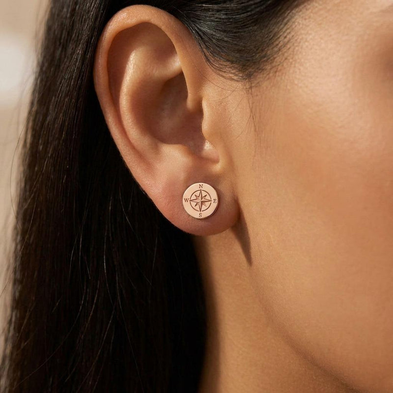 Pair of very small gold compass rose stud earrings with four points. (5 of 9)