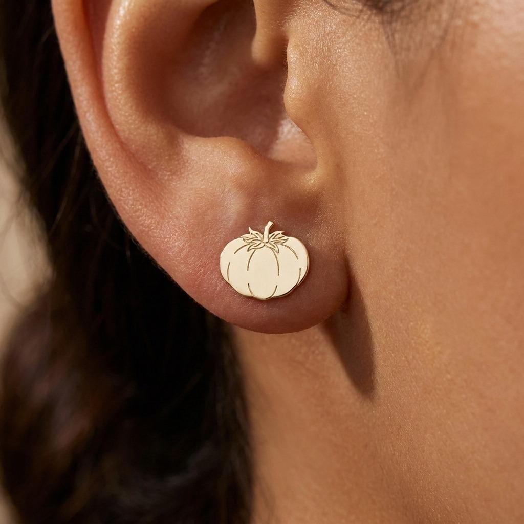 Pair of small gold tomato stud earrings with ribbed bodies and tiny stems (2 of 10)