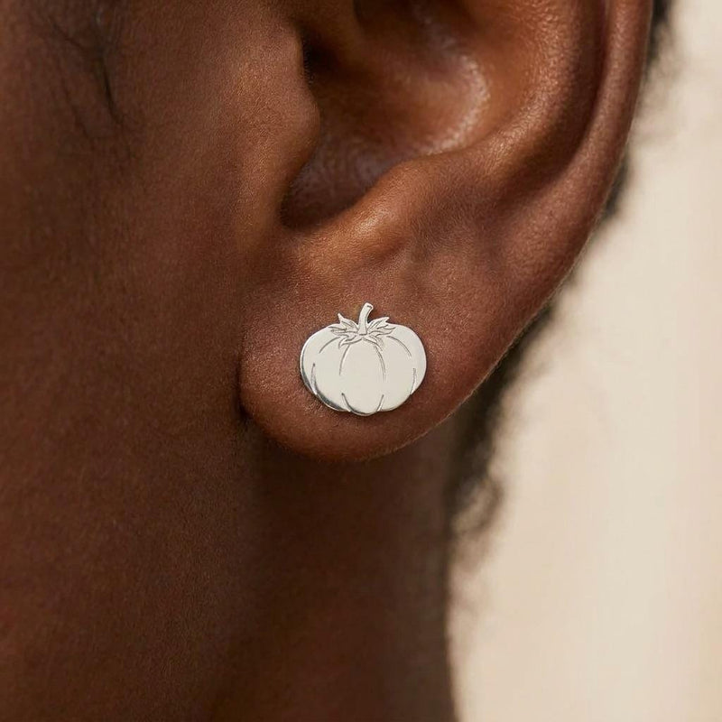 Pair of small gold tomato stud earrings with ribbed bodies and tiny stems (4 of 10)