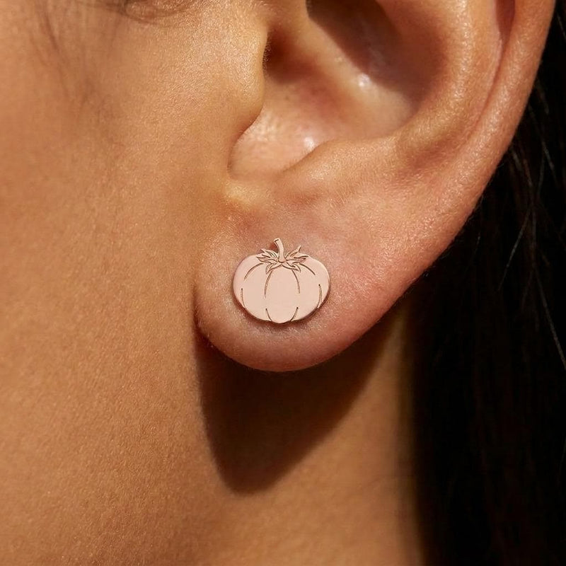 Pair of small gold tomato stud earrings with ribbed bodies and tiny stems (7 of 10)