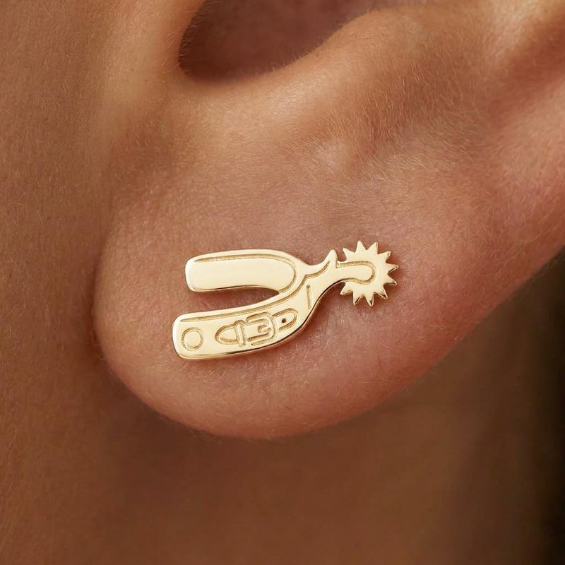 Pair of cowboy spur stud earrings in gold shown in profile with a rowel (2 of 10)