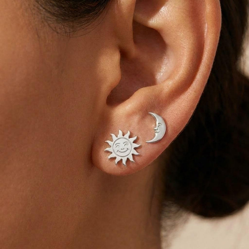 Mismatched gold sun and crescent moon stud earrings on posts (3 of 9)