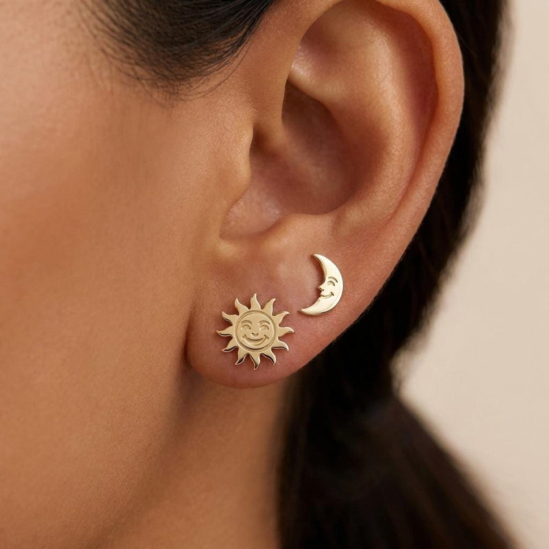 Mismatched gold sun and crescent moon stud earrings on posts (5 of 9)