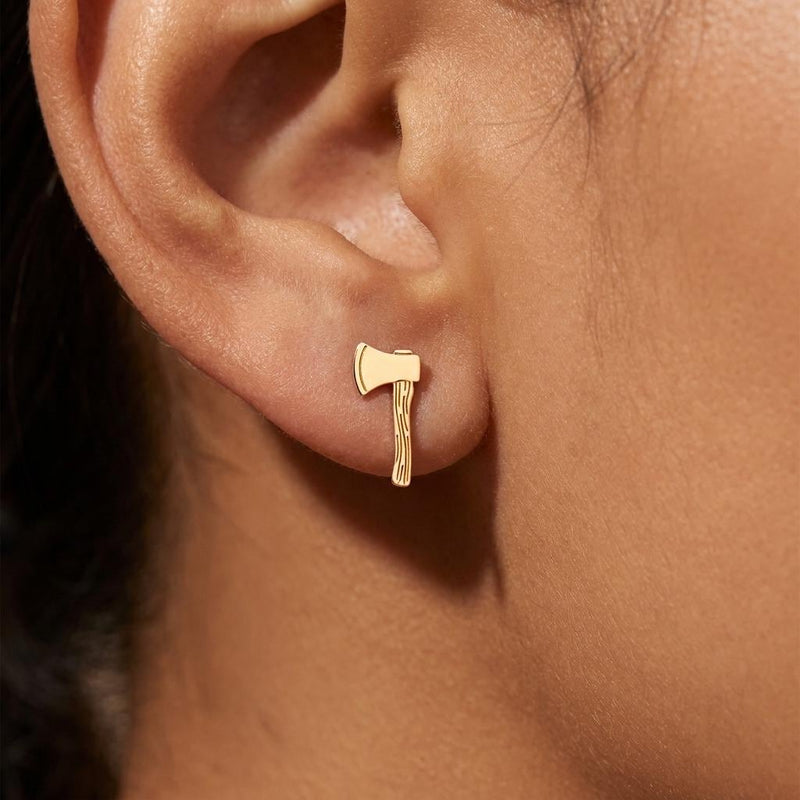 Pair of tiny gold axe stud earrings shown flat on a white background. (2 of 8)