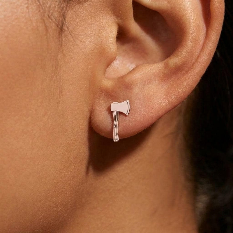 Pair of tiny gold axe stud earrings shown flat on a white background. (5 of 8)