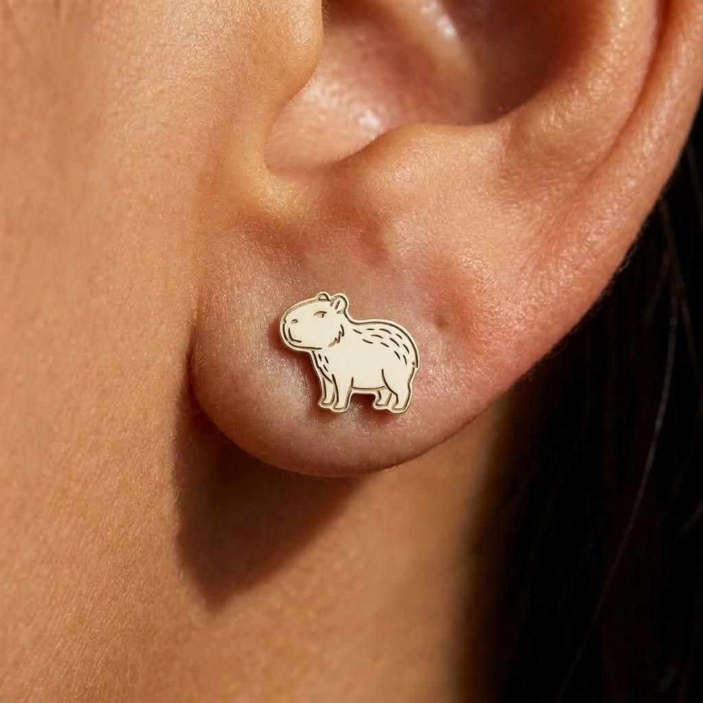 Pair of small gold capybara stud earrings shown sitting (2 of 9)