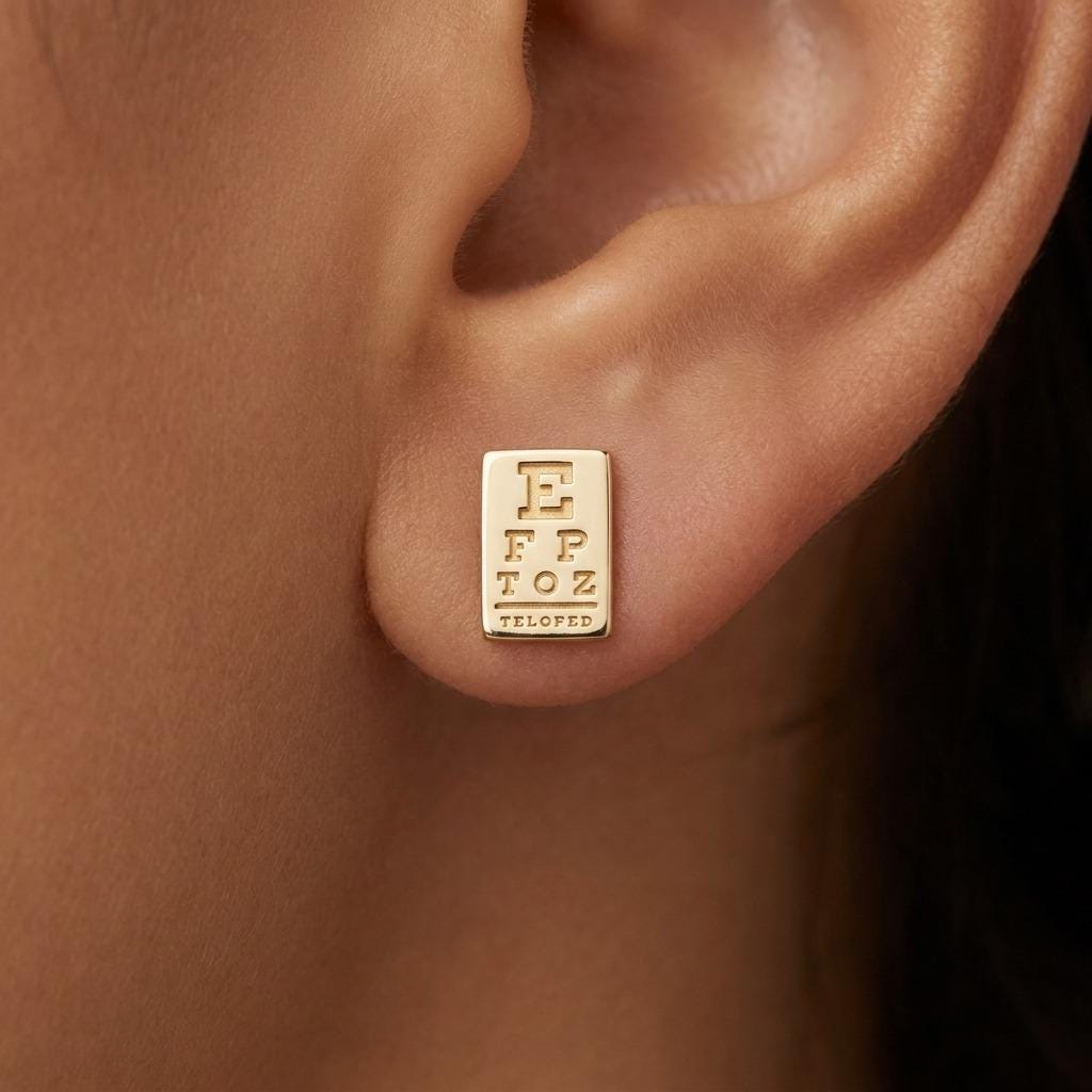 Pair of small eye chart stud earrings in gold with a large E and narrowing rows (2 of 6)
