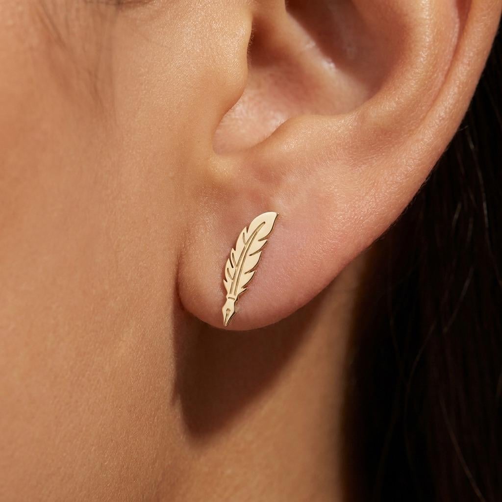 Pair of gold feather quill stud earrings with the nib pointing down (2 of 11)