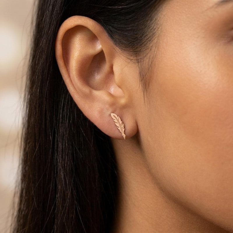 Pair of gold feather quill stud earrings with the nib pointing down (8 of 11)