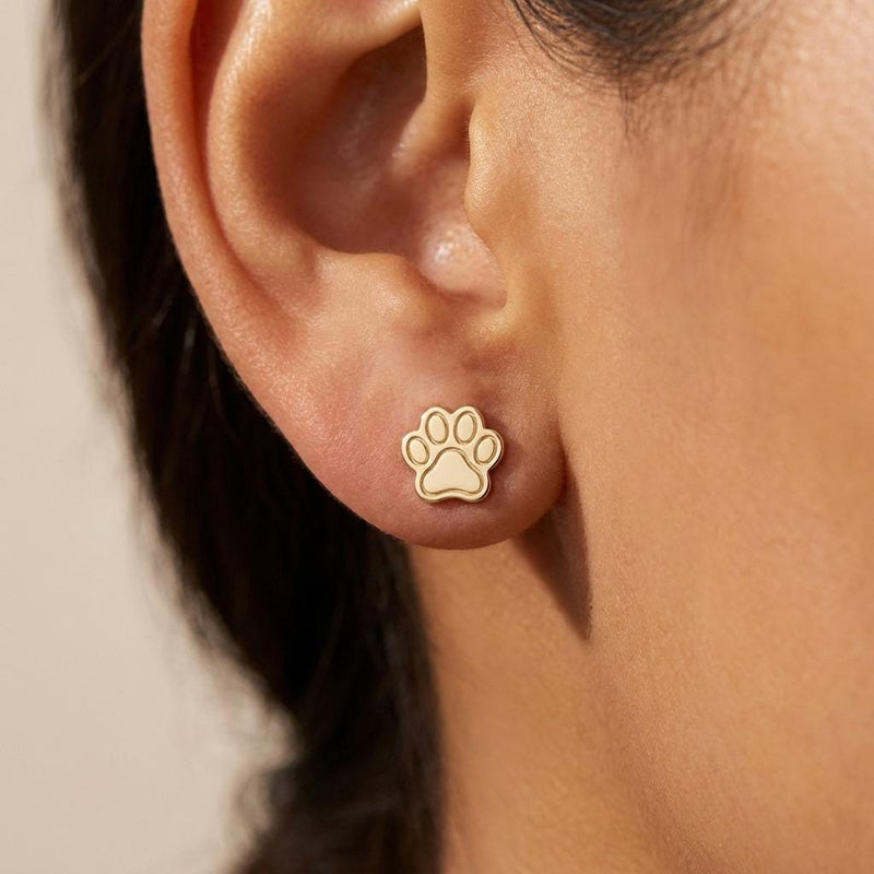 Pair of tiny gold paw print stud earrings with four toes and a rounded pad (6 of 10)