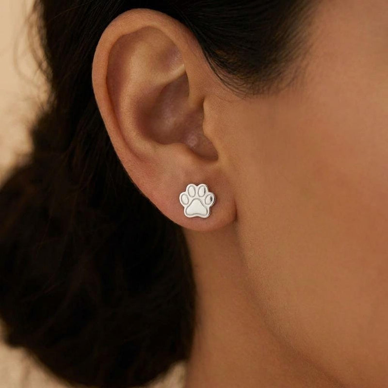 Pair of tiny gold paw print stud earrings with four toes and a rounded pad (7 of 10)