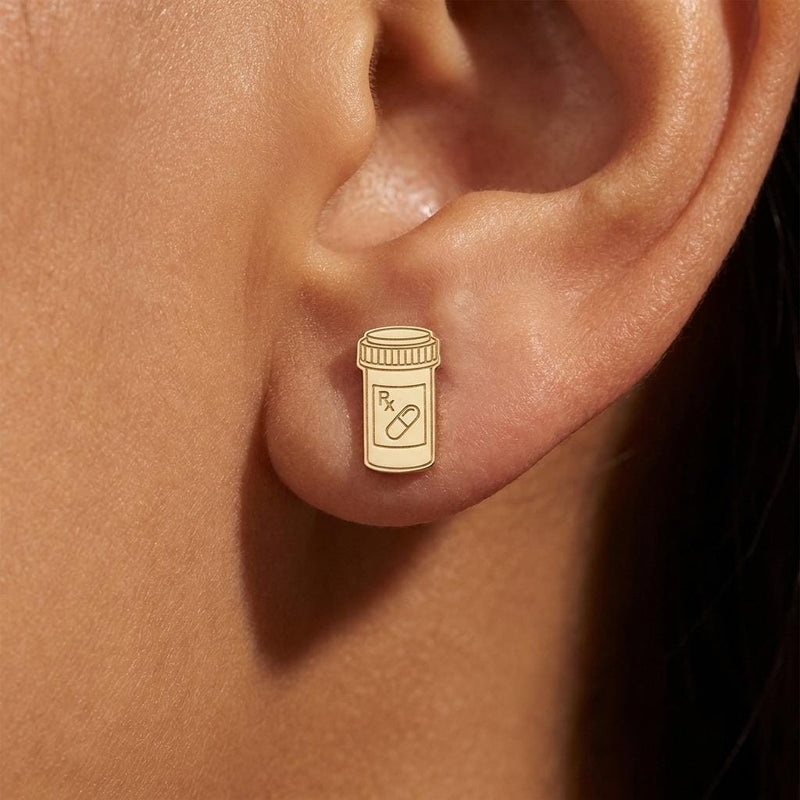 Small gold prescription pill bottle stud earrings with cap detail, shown as a pair (4 of 8)