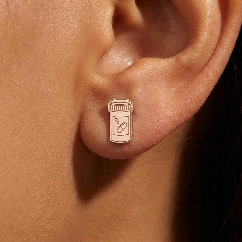Small gold prescription pill bottle stud earrings with cap detail, shown as a pair (5 of 8)