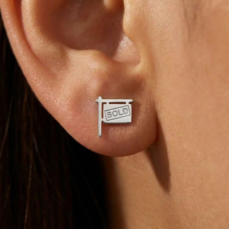Pair of small gold yard sign stud earrings with the word SOLD cut into the face (3 of 7)